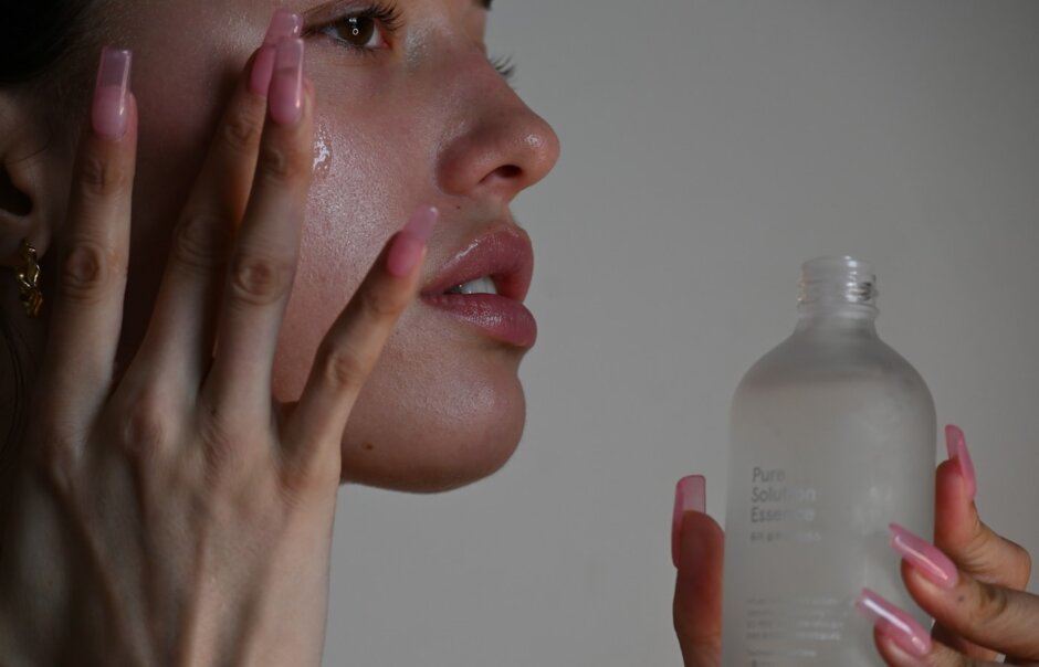 a person holding a bottle