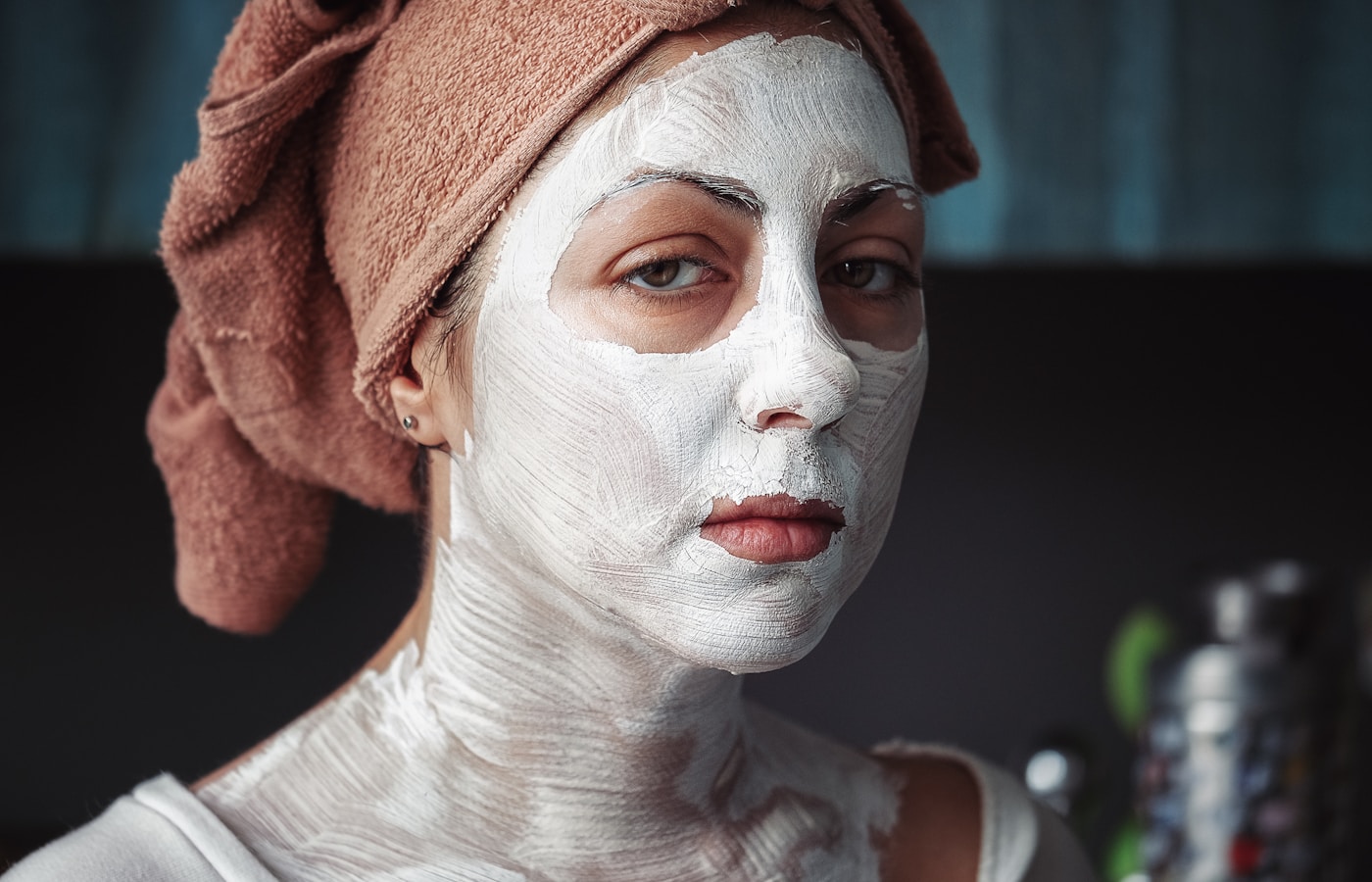 shallow focus photography of woman having a facial